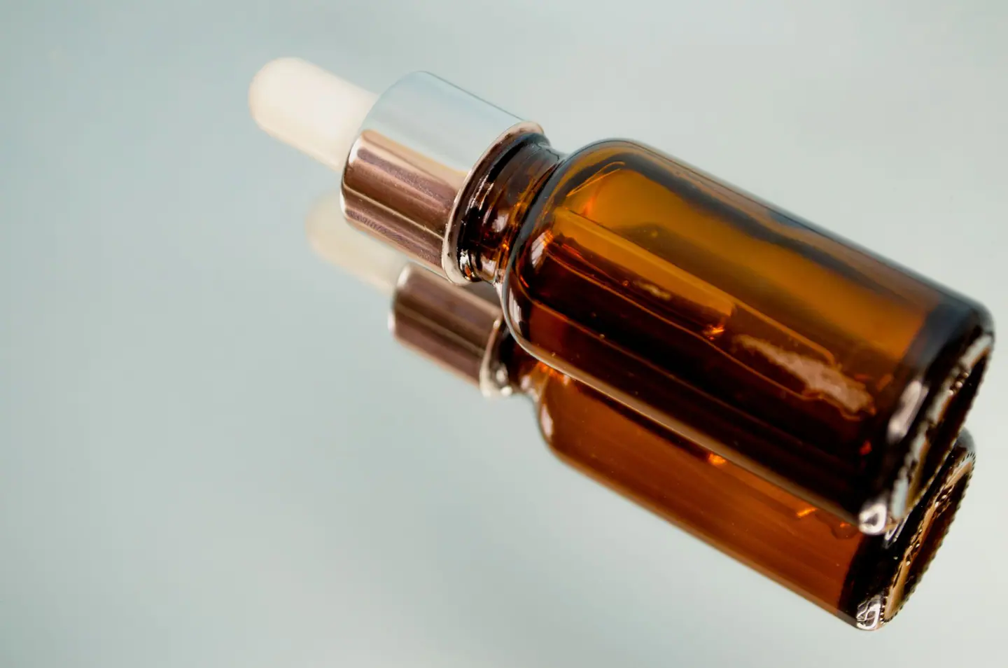 The serum in its amber dropper bottle